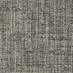 Elegant club chair in Zepel’s Fireguard neutral earth-tone fabric