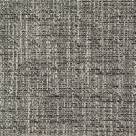 Elegant club chair in Zepel’s Fireguard neutral earth-tone fabric
