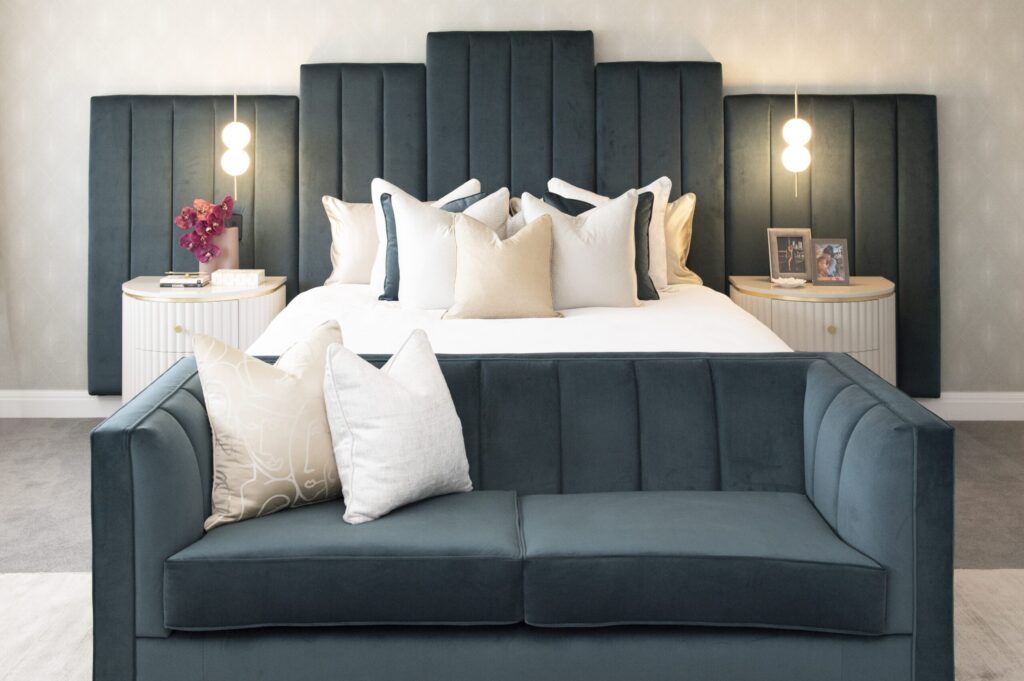 Designer bedroom setup with custom-stained wood bed in luxury home